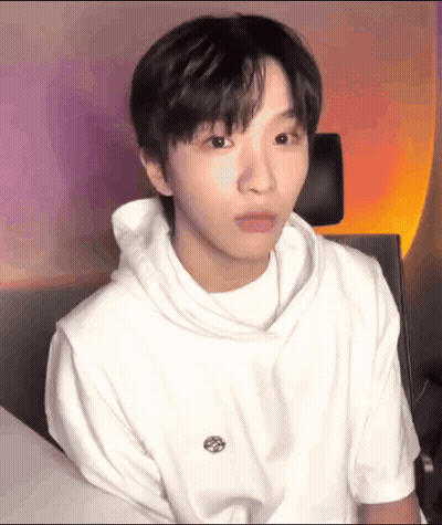 Young Man In White Hoodie Making Funny Face GIF