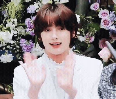 Young Man In White Jacket Making Heart With Hands GIF