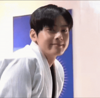 Young Man In White Karate Uniform Making A Face GIF