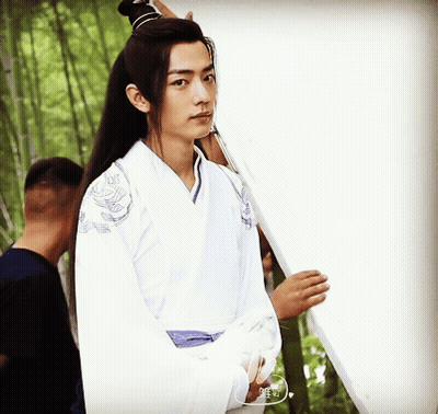 Young Man In White Kimono Holding White Board GIF