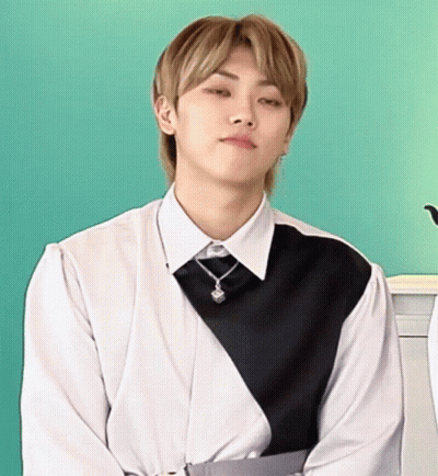 Young Man In White Shirt And Black Vest GIF