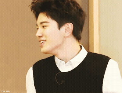 Young Man In White Shirt And Black Vest Says It's You GIF