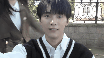 Young Man In White Shirt And Black Vest Selfie GIF