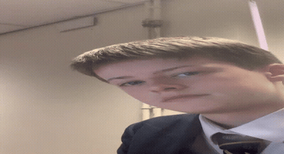Young Man In White Shirt And Blue Tie With Letter G GIF