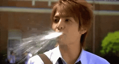 Young Man In White Shirt And Tie Drinking Water GIF