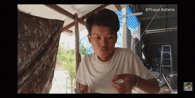 Young Man In White Shirt Eating Meal GIF