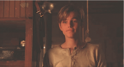 Young Man In White Shirt Looking At Camera GIF