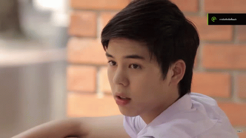 Young Man In White Shirt Looking GIF