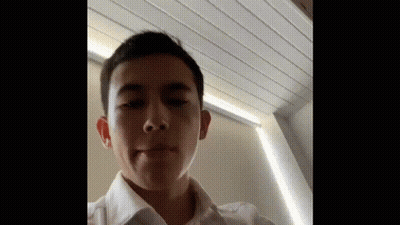 Young Man In White Shirt Making Funny Face GIF