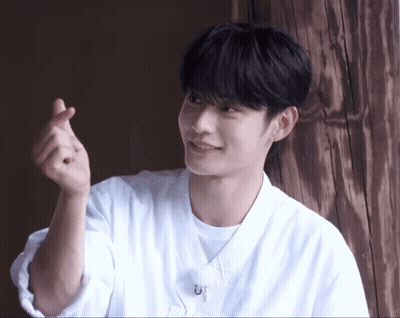 Young Man In White Shirt Making Heart With Hands GIF