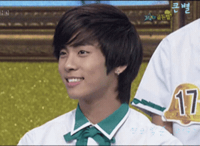 Young Man In White Shirt With Green Collar And Number 17 GIF