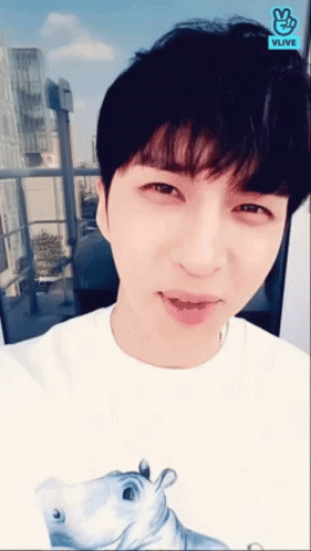 Young Man In White Shirt With Hippo And Vlive Logo GIF