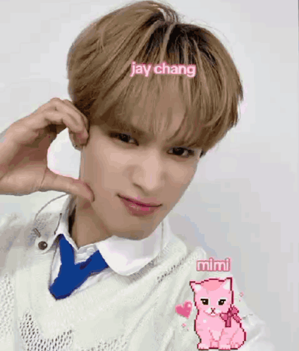 Young Man In White Sweater And Blue Tie Making Heart GIF