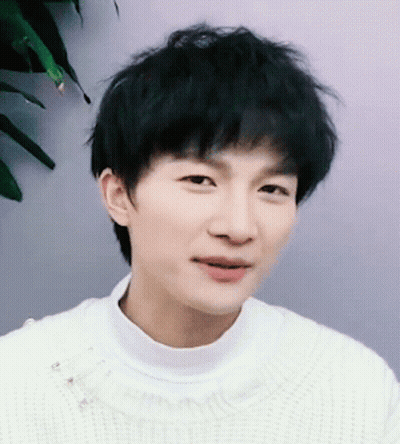 Young Man In White Sweater Close Up GIF
