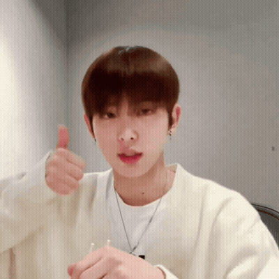Young Man In White Sweater Thumbs Up GIF