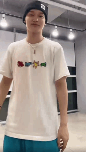 Young Man In White T-Shirt And Black Beanie GIF