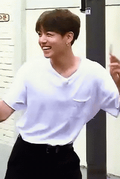 Young Man In White T-Shirt And Black Pants GIF