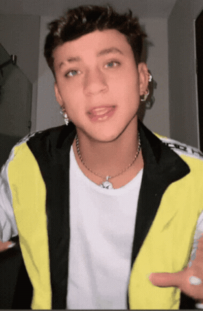 Young Man In White T-Shirt And Black Yellow Jacket GIF