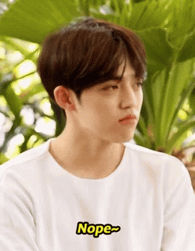 Young Man In White T-Shirt Saying Nope GIF