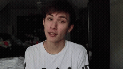 Young Man In White T-Shirt Talking To Camera GIF