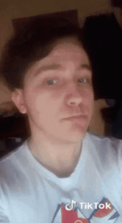 Young Man In White T-Shirt With TikTok Logo GIF