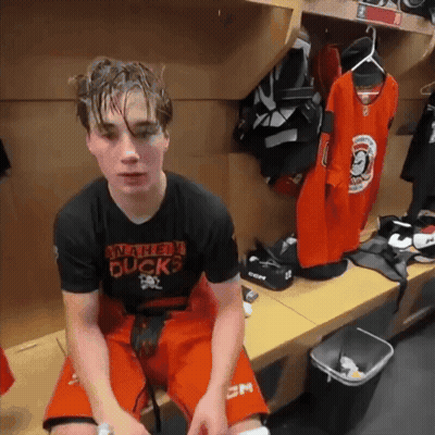 Young Man in Winnipeg Ducks Shirt in Locker Room
