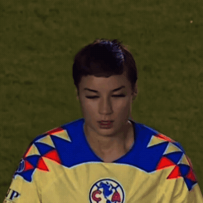 Young Man In Yellow And Blue Jersey With Soccer Ball GIF