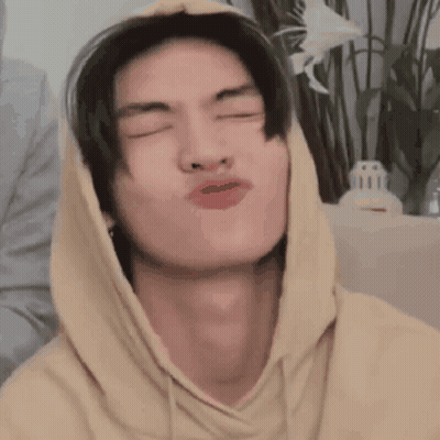 Young Man In Yellow Hoodie Making Funny Face GIF