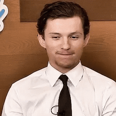 Young Man In Yellow Shirt With Earbuds GIF