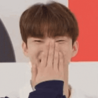 Young Man Laughing And Covering Face GIF