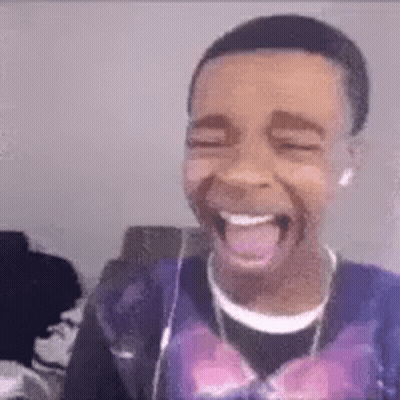 Young Man Laughing And Tongue Out With Headphones GIF