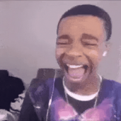 Young Man Laughing Tongue Out Headphones Purple Shirt GIF