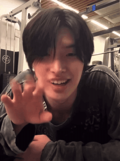 Young Man Laying On Floor In Front Of Gym Machine With Letter G GIF