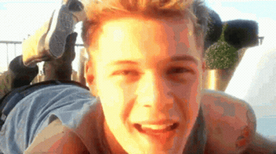 Young Man Laying With Converse Shoe On Head GIF
