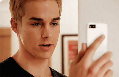 Young Man Looking At Cell Phone GIF