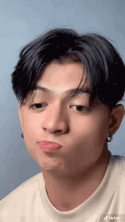 Young Man Making Funny Face GIF