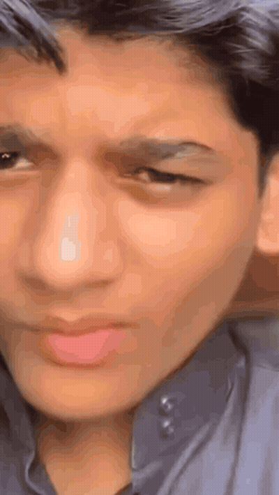 Young Man Making Funny Face Eyes Closed GIF