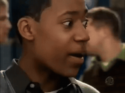 Young Man Making Funny Face in Crowd