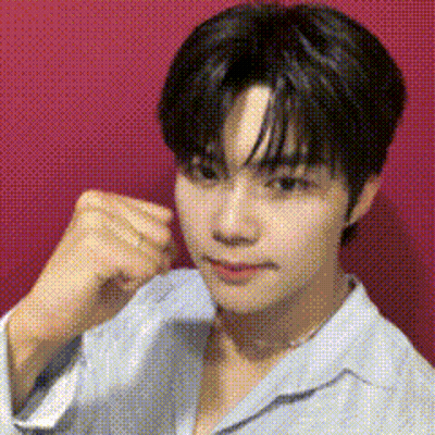 Young Man Making Funny Face In Front Of Red Wall GIF