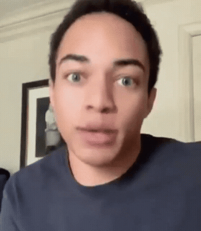 Young Man Making Funny Face Looking At Camera GIF