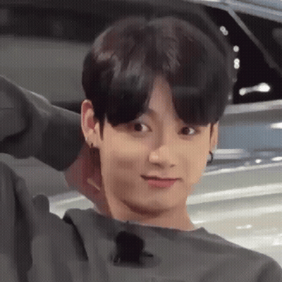 Young Man Making Funny Face Next To Car GIF