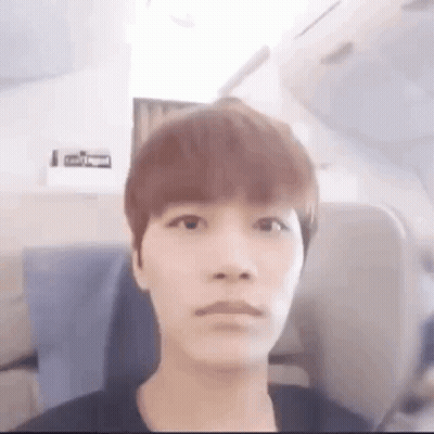 Young Man Making Funny Face On Airplane GIF