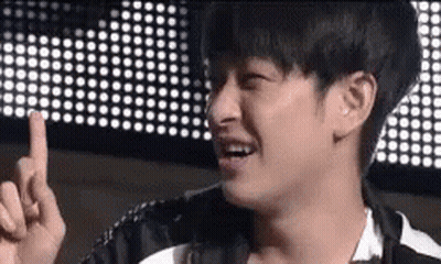 Young Man Making Funny Face Pointing At Camera GIF