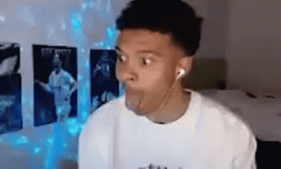 Young Man Making Funny Face With Headphones GIF