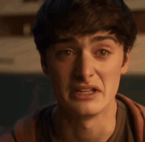 Young Man Making Funny Face With Mouth Open Eyes Closed GIF