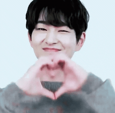 Young Man Making Heart Hands GIF