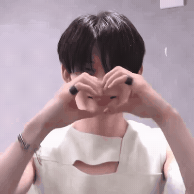 Young Man Making Heart Shape With Hands GIF