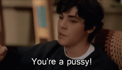 Young Man On Couch Saying You're A Pussy GIF