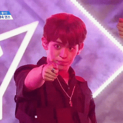 Young Man Pointing At Camera In Black Shirt And Necklace GIF