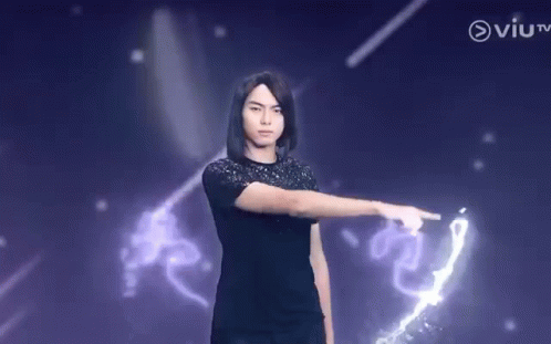 Young Man Pointing At Purple Background GIF
